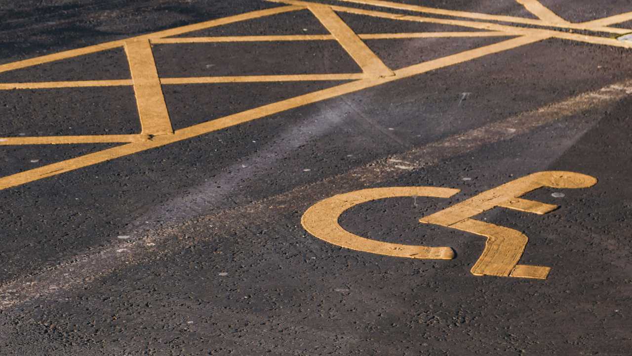 Yellow Disabled Icon Painted on a Parking Bay