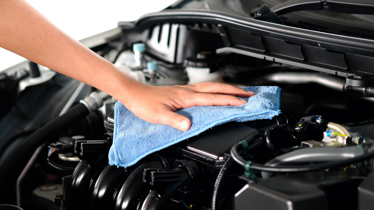 Wiping up car engine