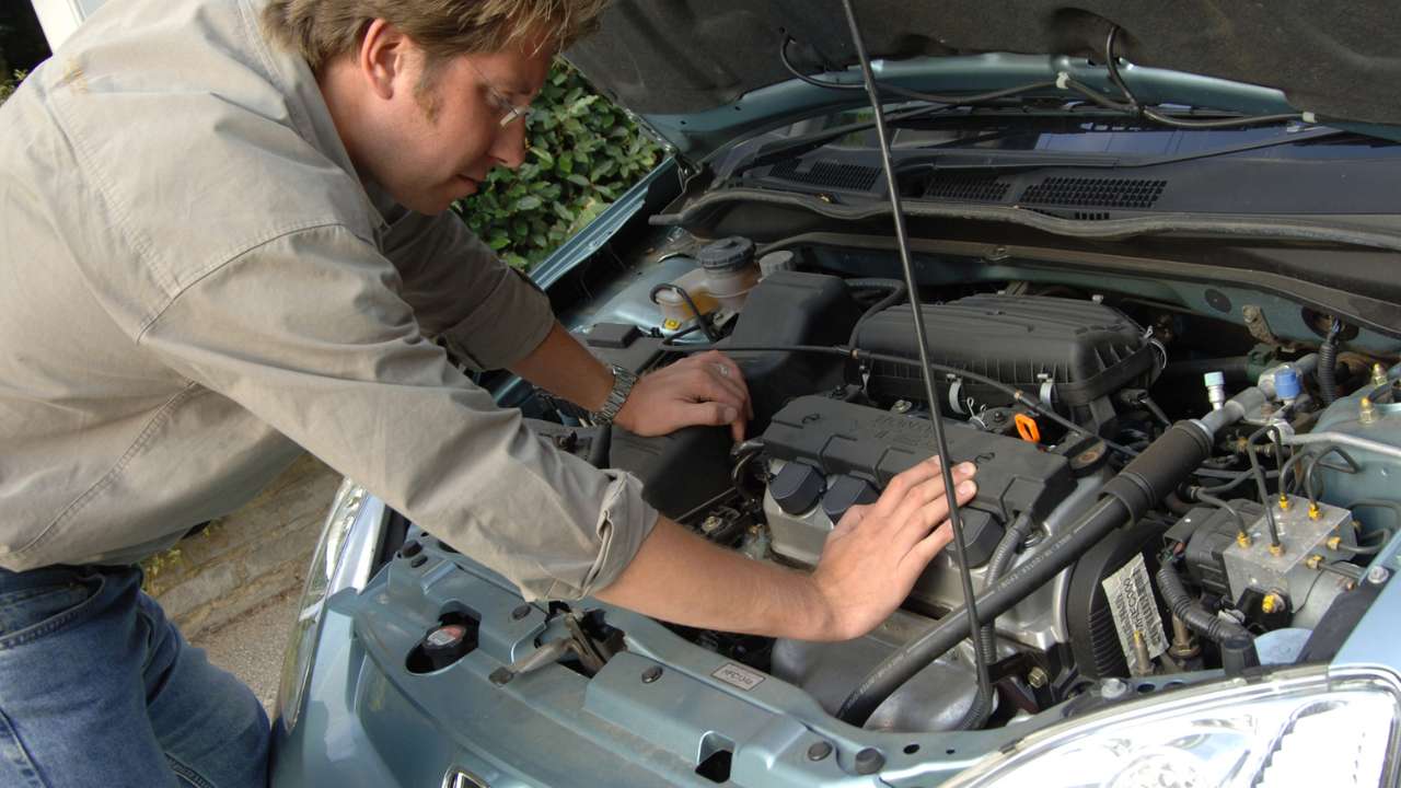 Guy Checking Under Bonnet