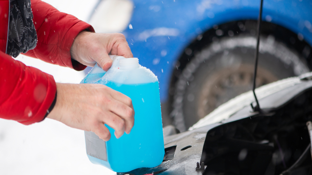 Man Holding Car Coolant