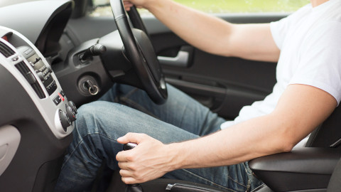 Driver Using Gearstick In Manual Car