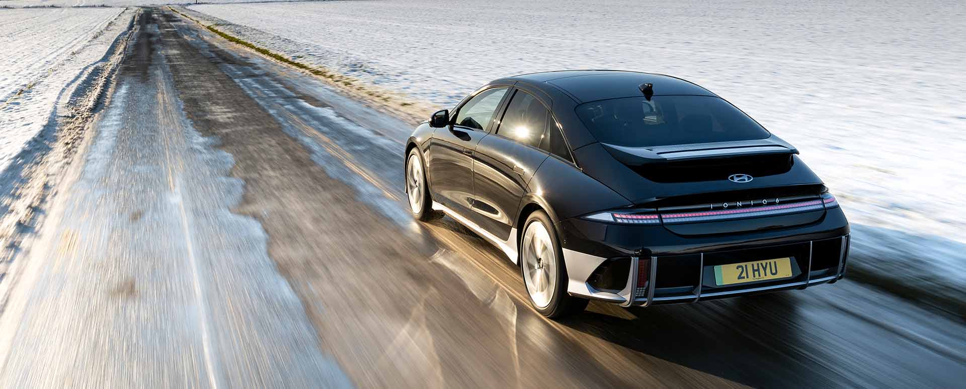 Rear Shot of Hyundai IONIQ 6 Driving On Icy Road