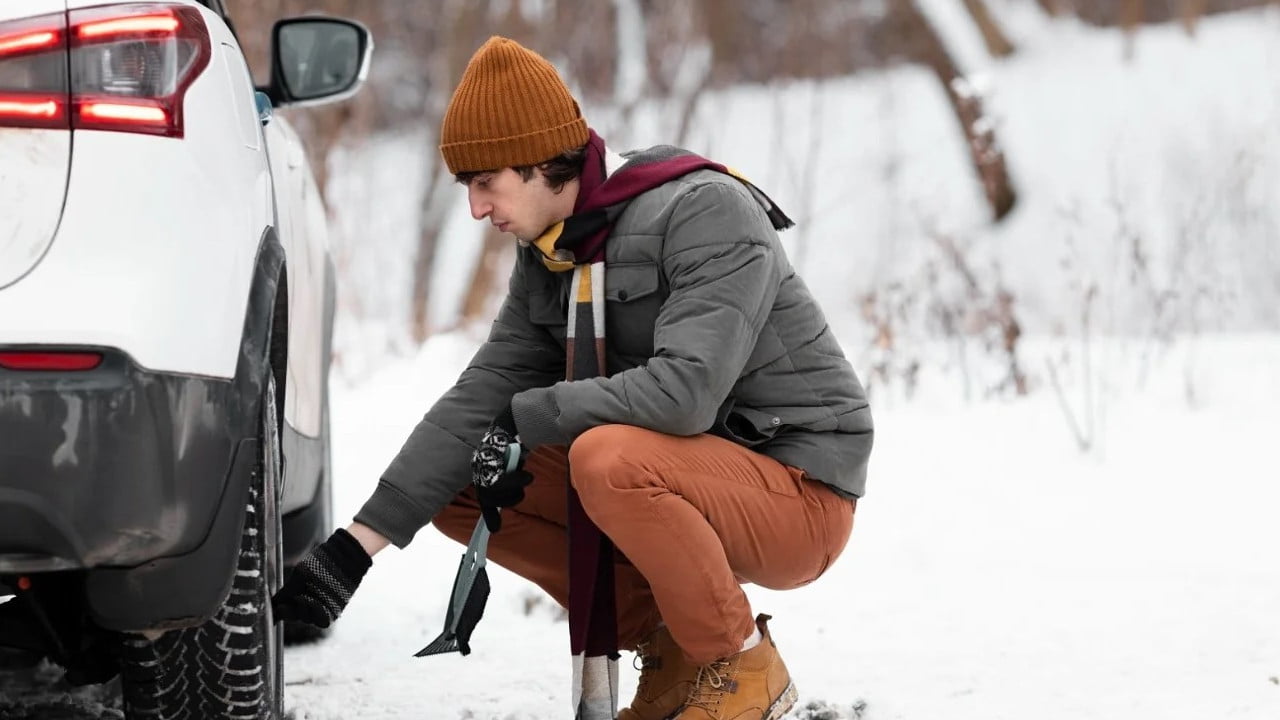 Checking Tyre in Snow