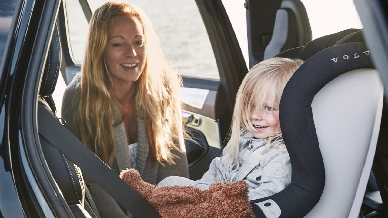 Child In Car Seat With Mother