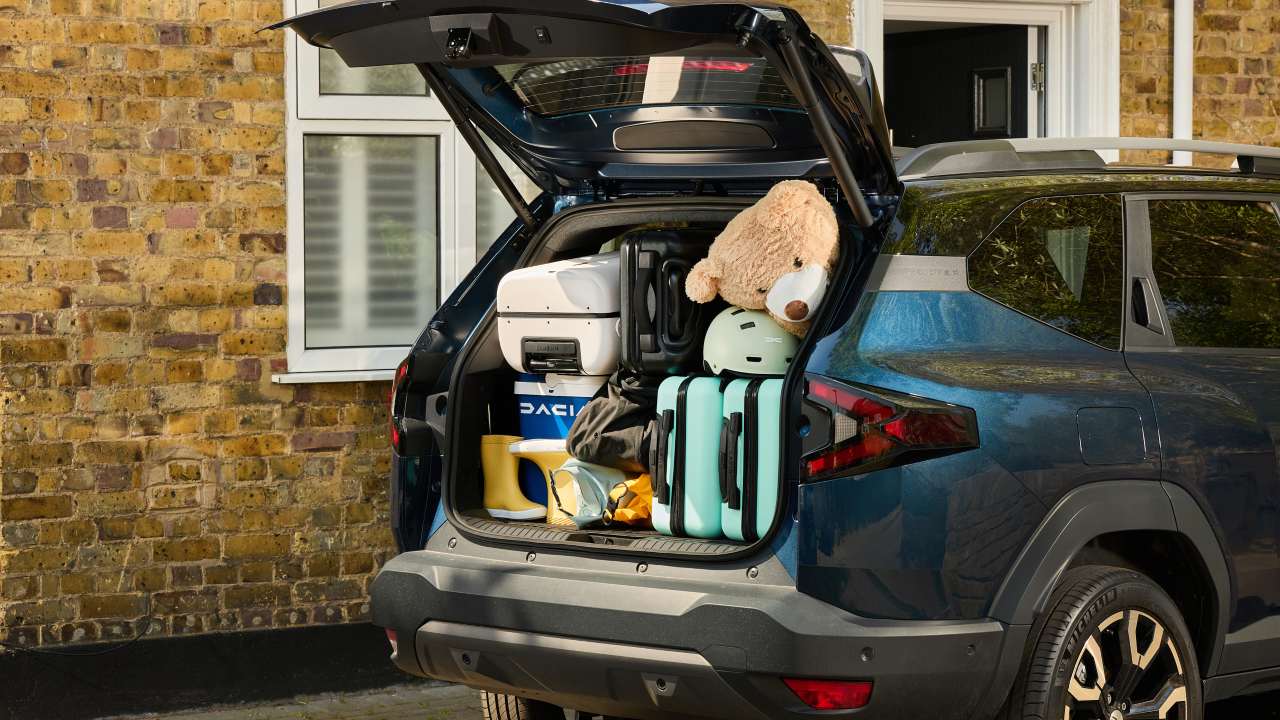 Blue Dacia Bigster with boot fully packed