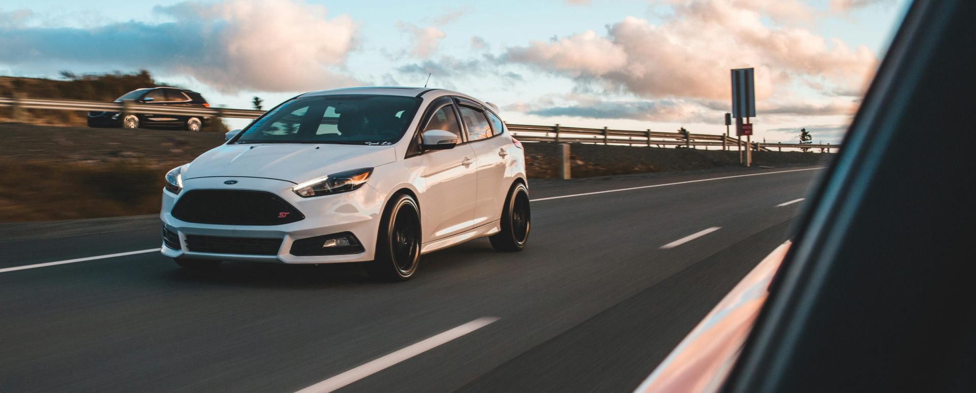 White Ford Focus ST Overtaking Traffic on Motorway