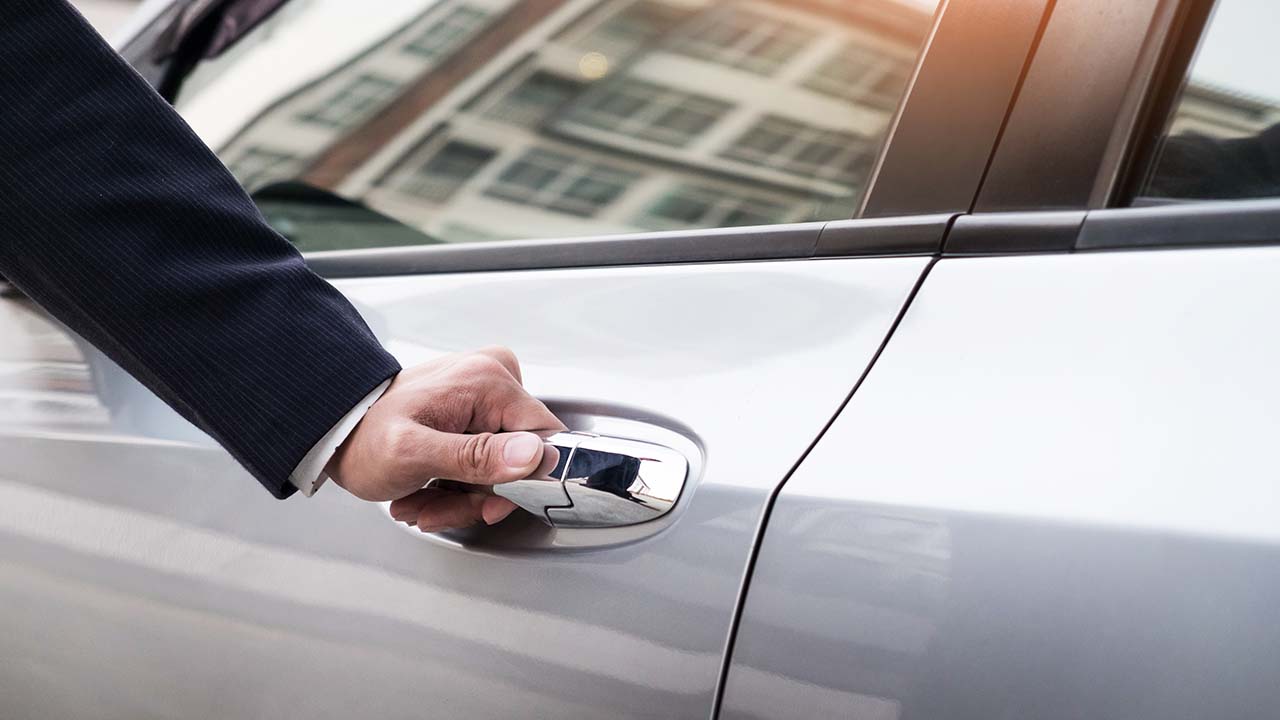 Man Opening a Car Door