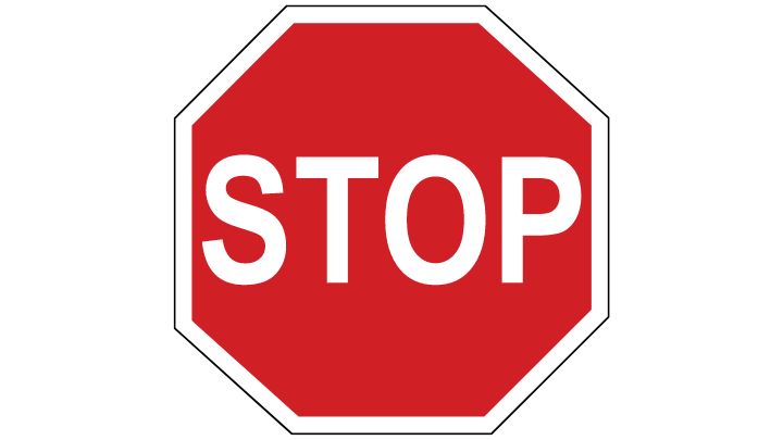 Red octagonal circle with a thick white outline, with stop written in white in the centre of the sign