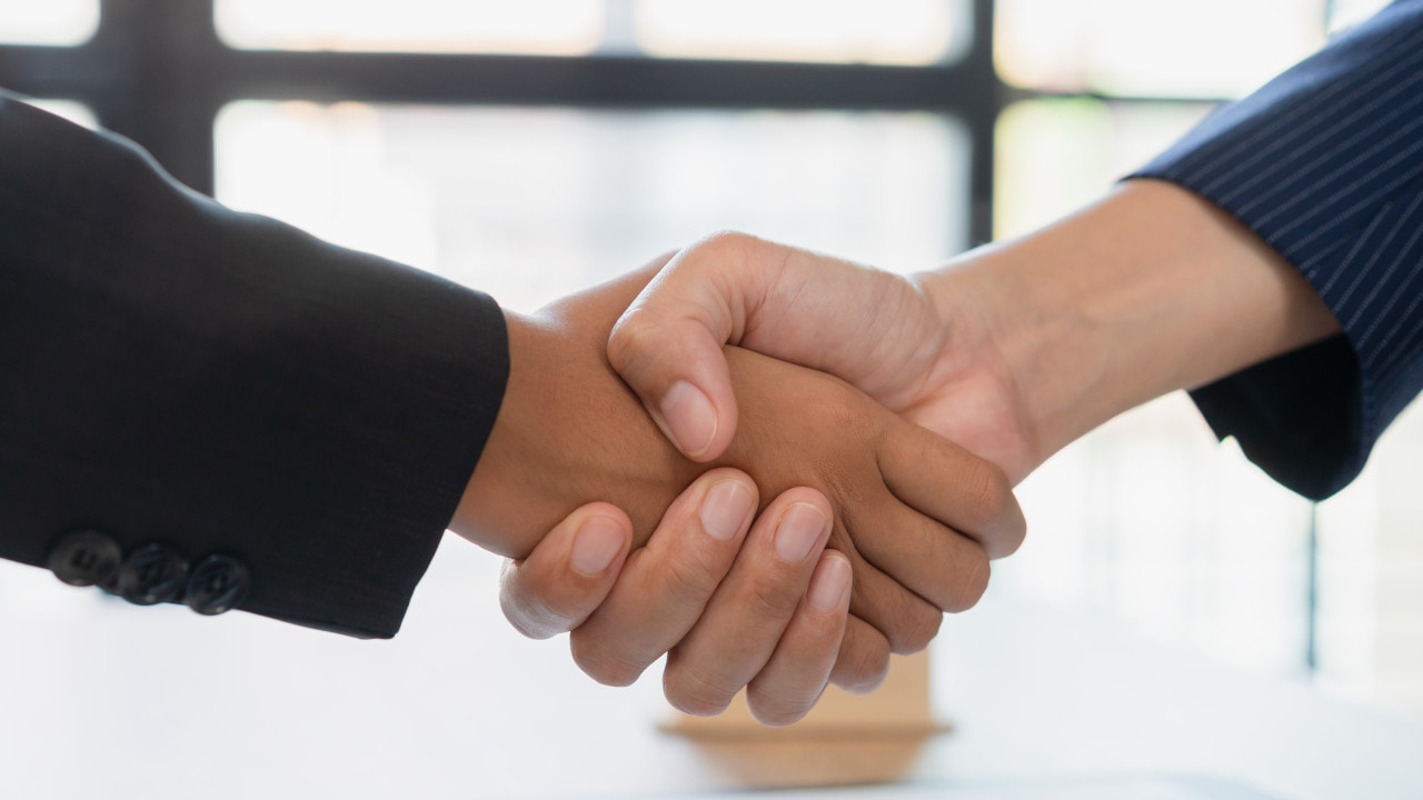 Two People Shaking Hands