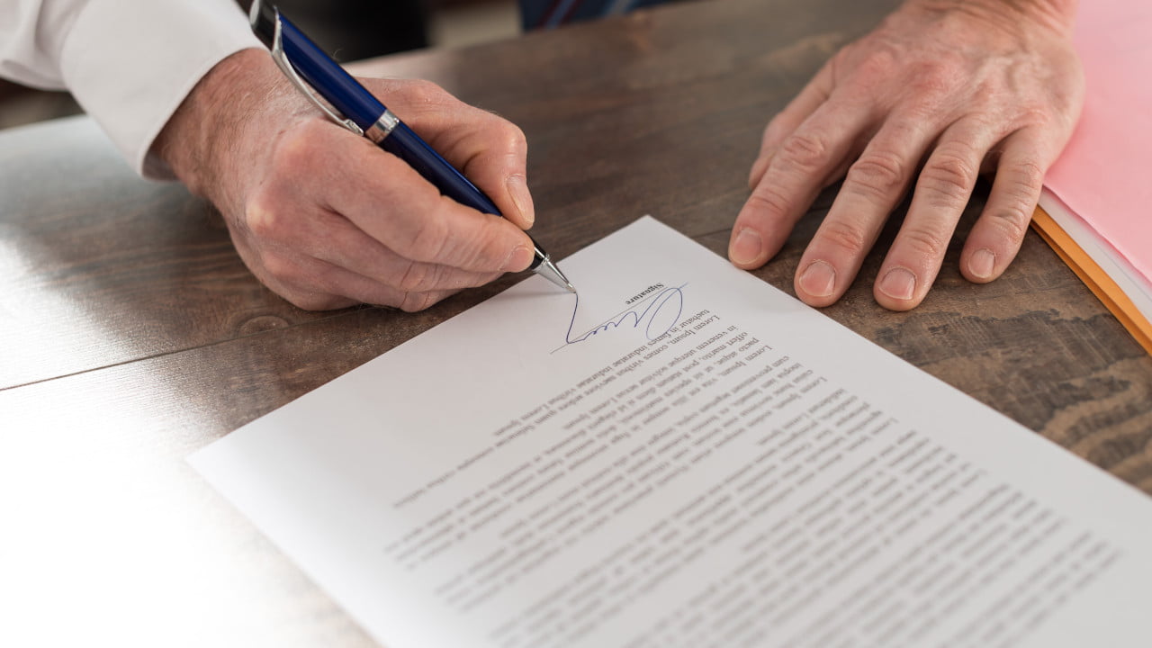 Business Man Signing Document