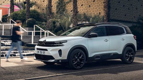 White Citroen C5 Aircross parked in front of stairs in the street