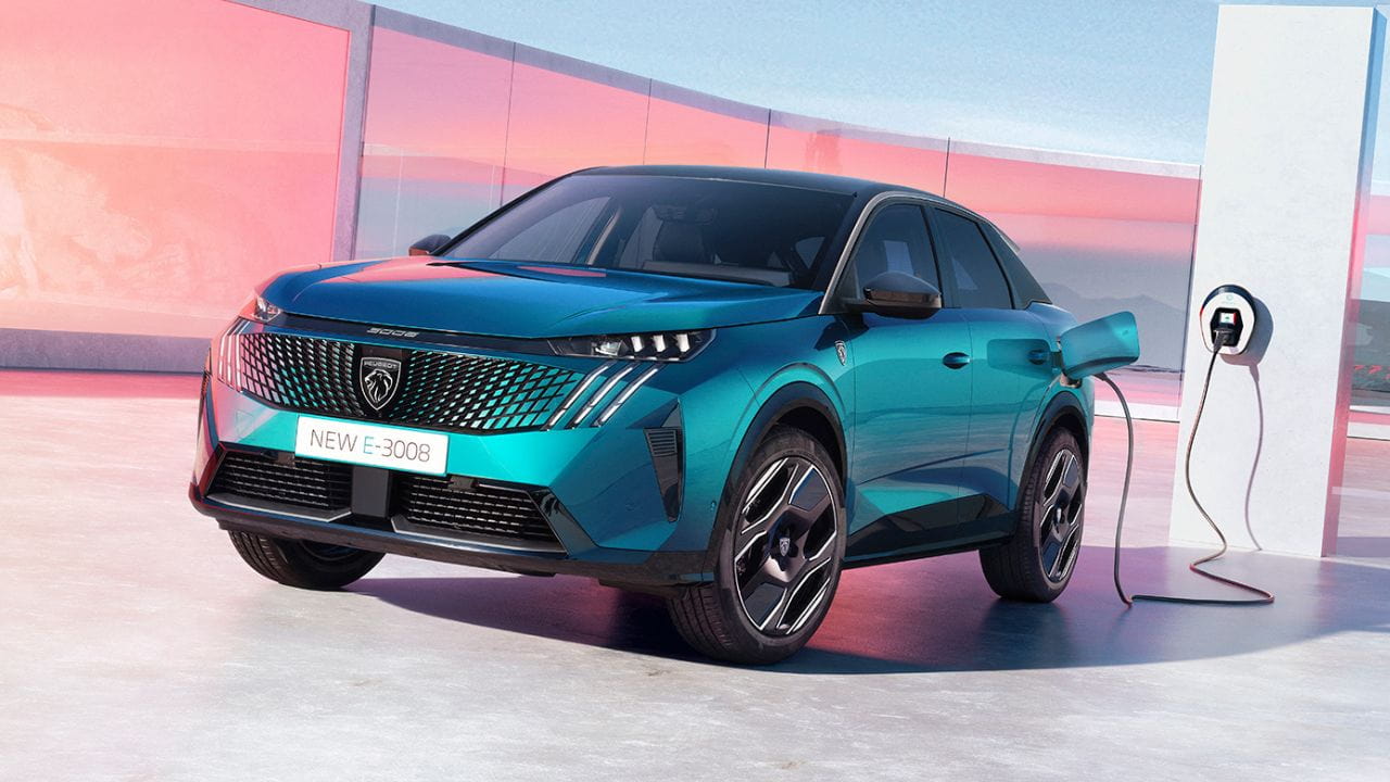 Blue Peugeot 3008 being charged in front of pink windows