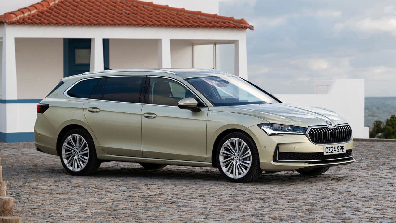 Skoda Superb parked in front of a beach house