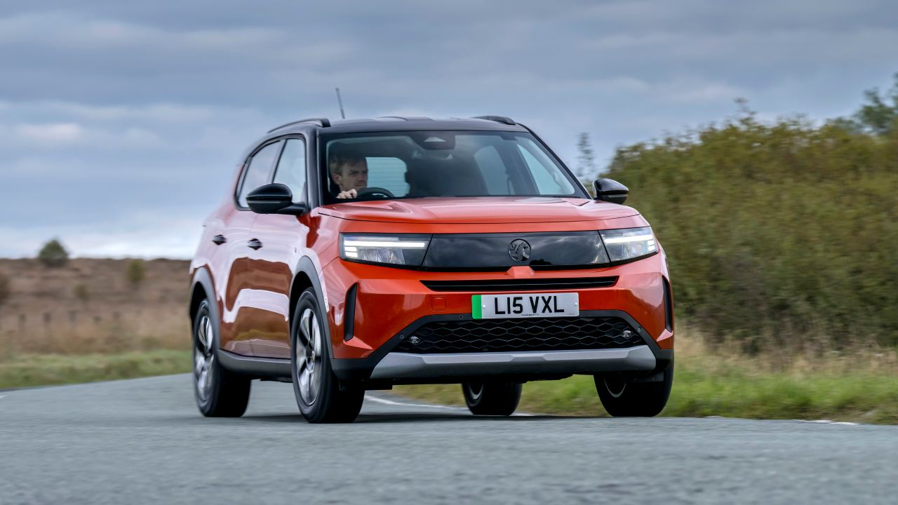 Front view of a Vauxhall Frontera driving along a country road