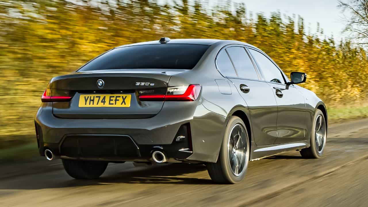 BMW 330e Driving Rear Angle in Grey