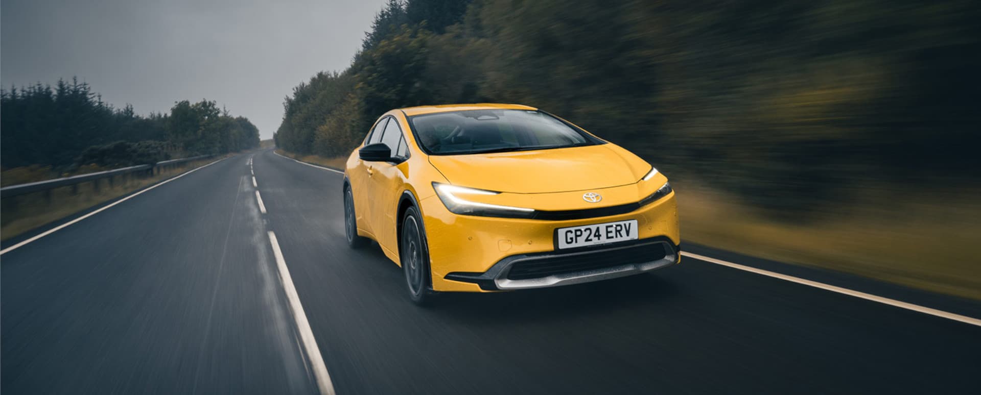 Toyota Prius in Yellow Driving