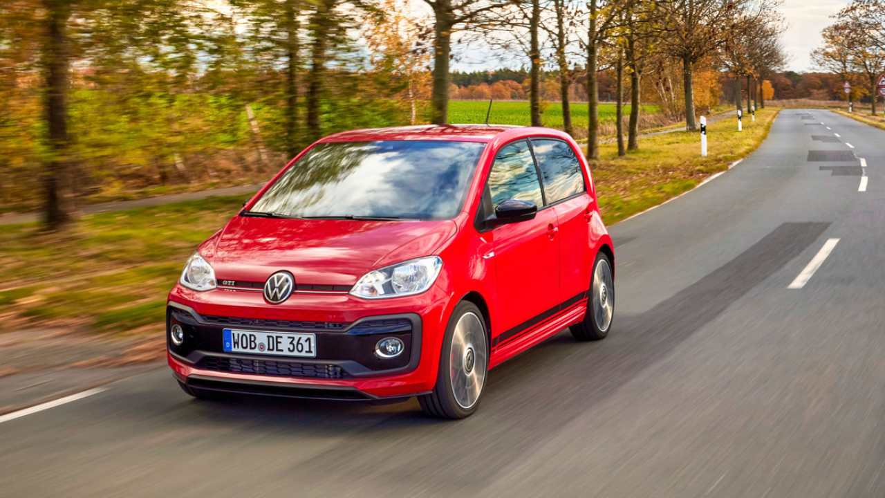 Red Volkswagen up! Exterior Front Driving