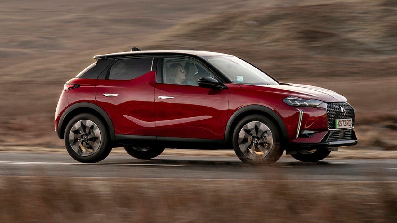 Red DS 3 driving in the countryside