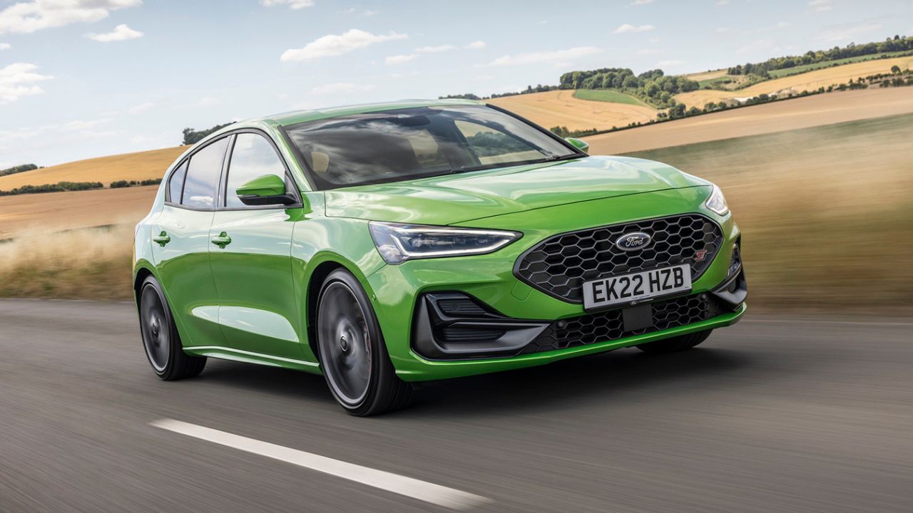 Green Ford Focus ST driving on the motorway