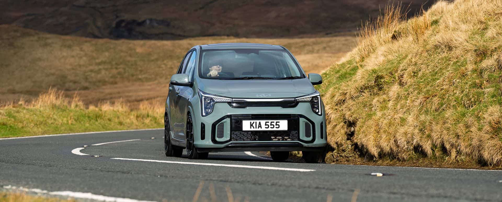 Kia Picanto driving on the motorway in the countryside