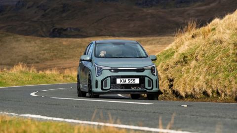 Kia Picanto driving on the motorway in the countryside