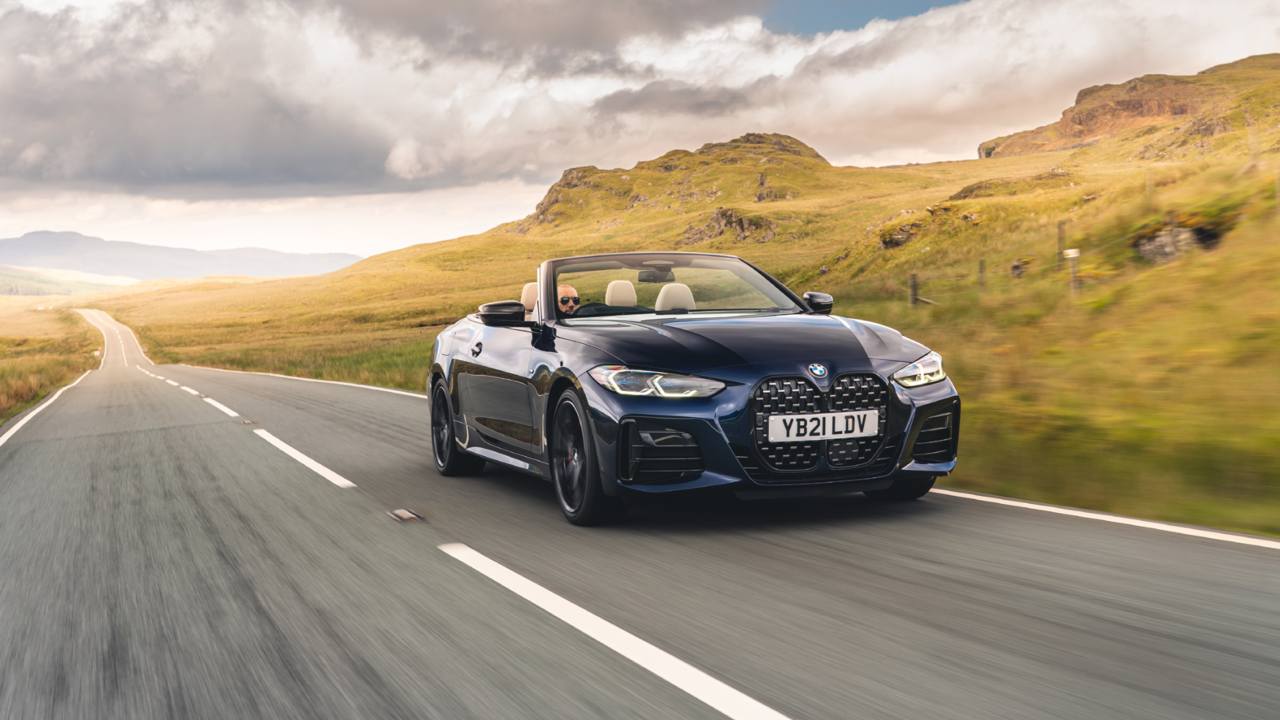 Black BMW 4 Series Convertible Exterior Front Driving