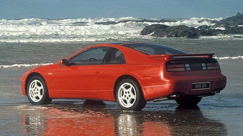 Red Nissan 300ZX rear quarter shot, parked on a beach