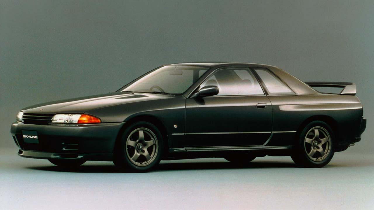 Black Nissan Skyline GT-R, parked in a studio