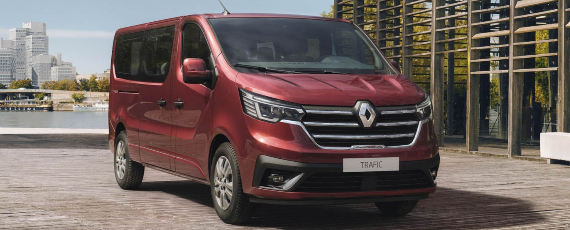 Red Renault Trafic parked by the ocean