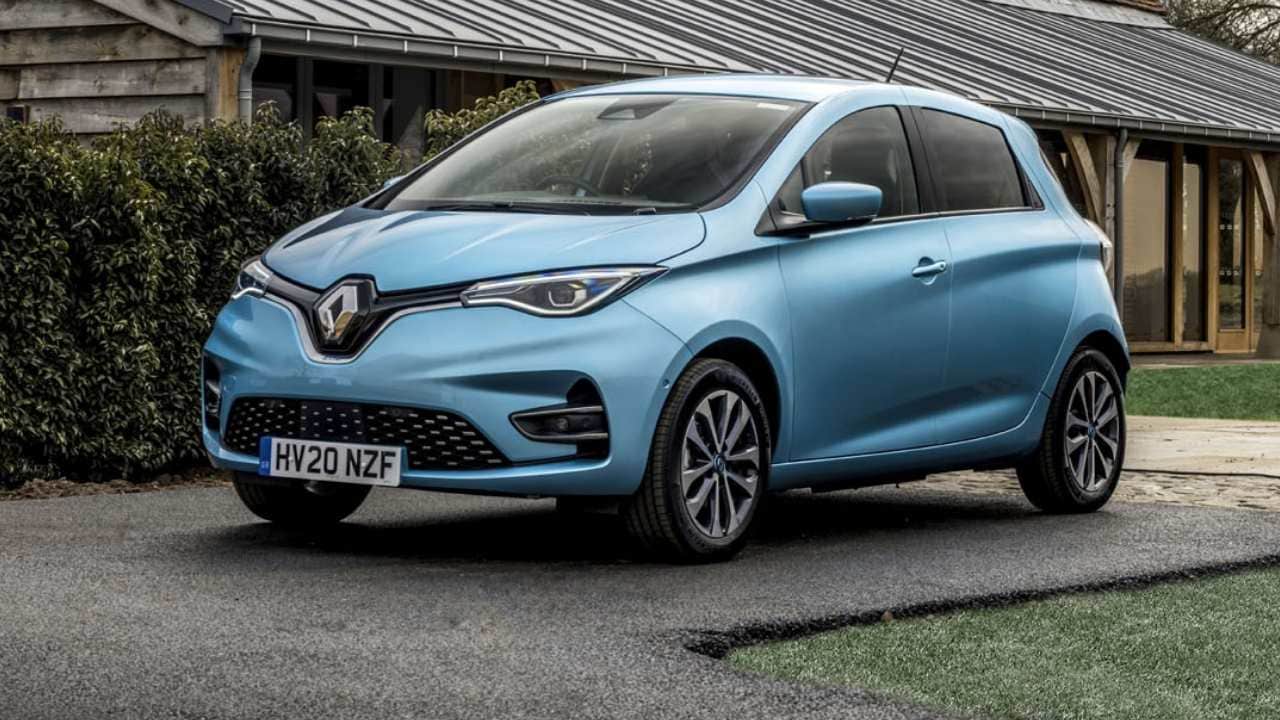 Blue Renault ZOE parked in front of a house
