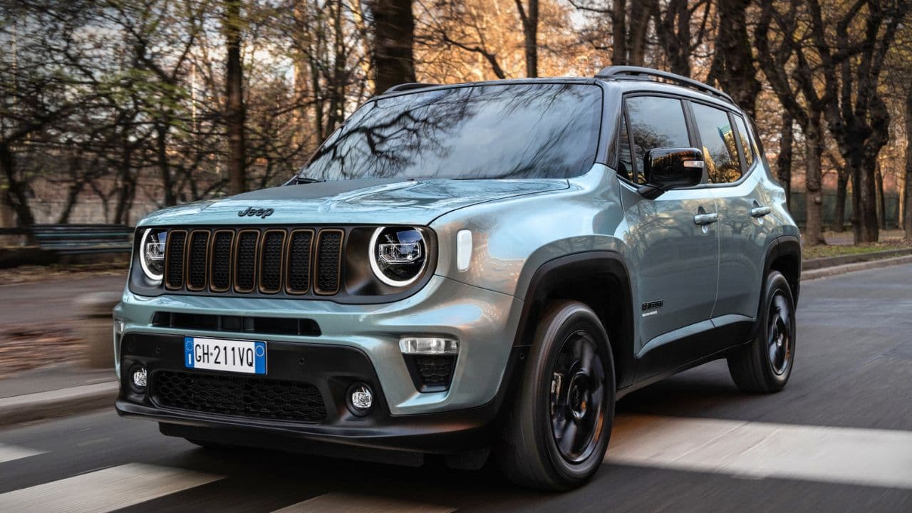 Silver Jeep Renegade driving on the road