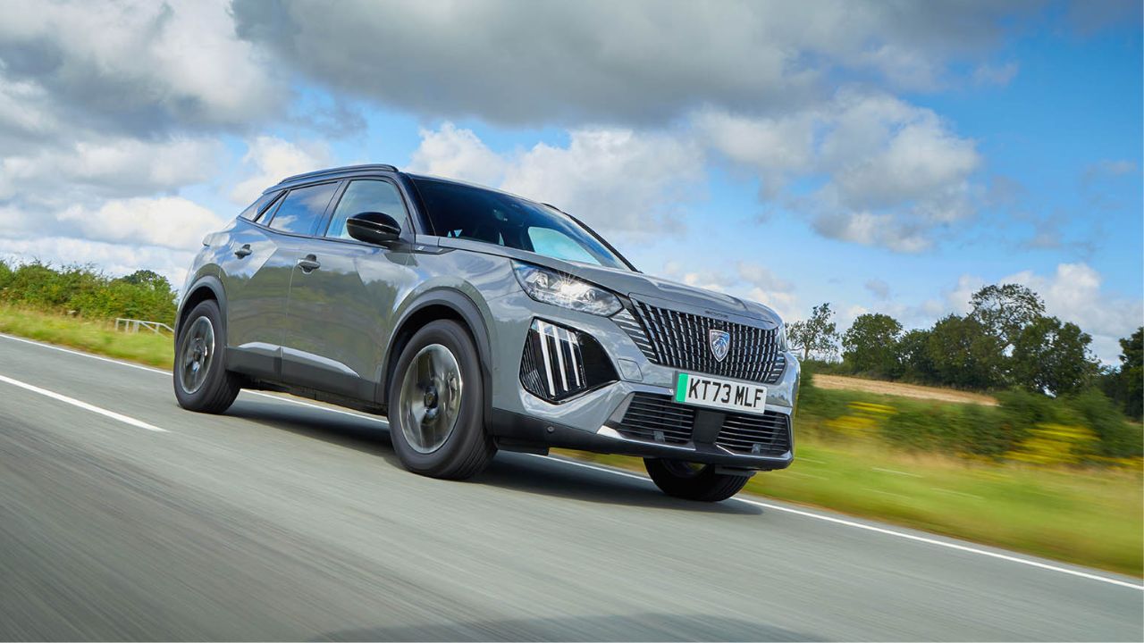 Grey Peugeot 2008 driving in the countryside
