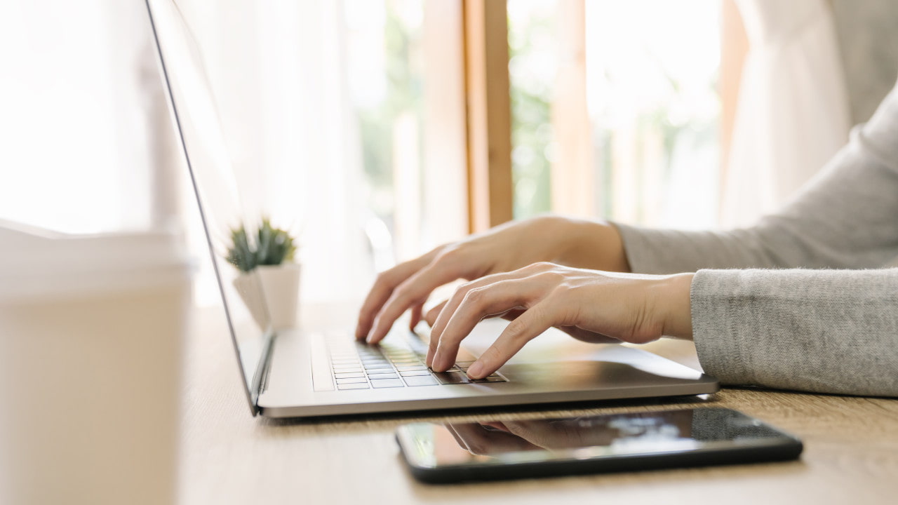 Woman on Laptop on Desk