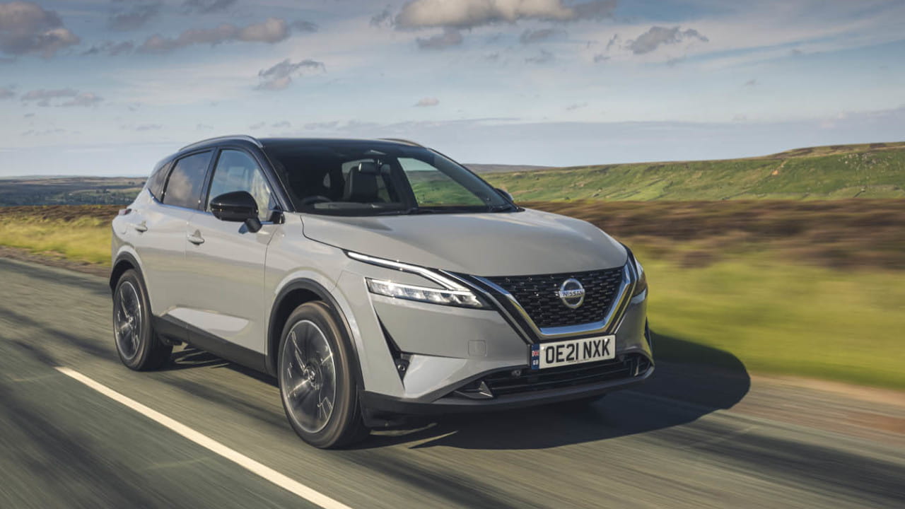 Grey Nissan Qashqai driving in the countryside