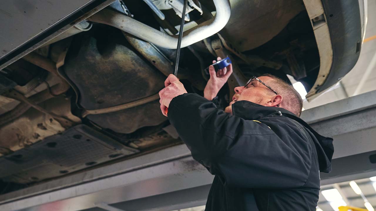Technician performing vehicle health check