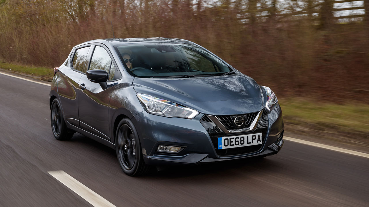 Grey Nissan Micra, driving