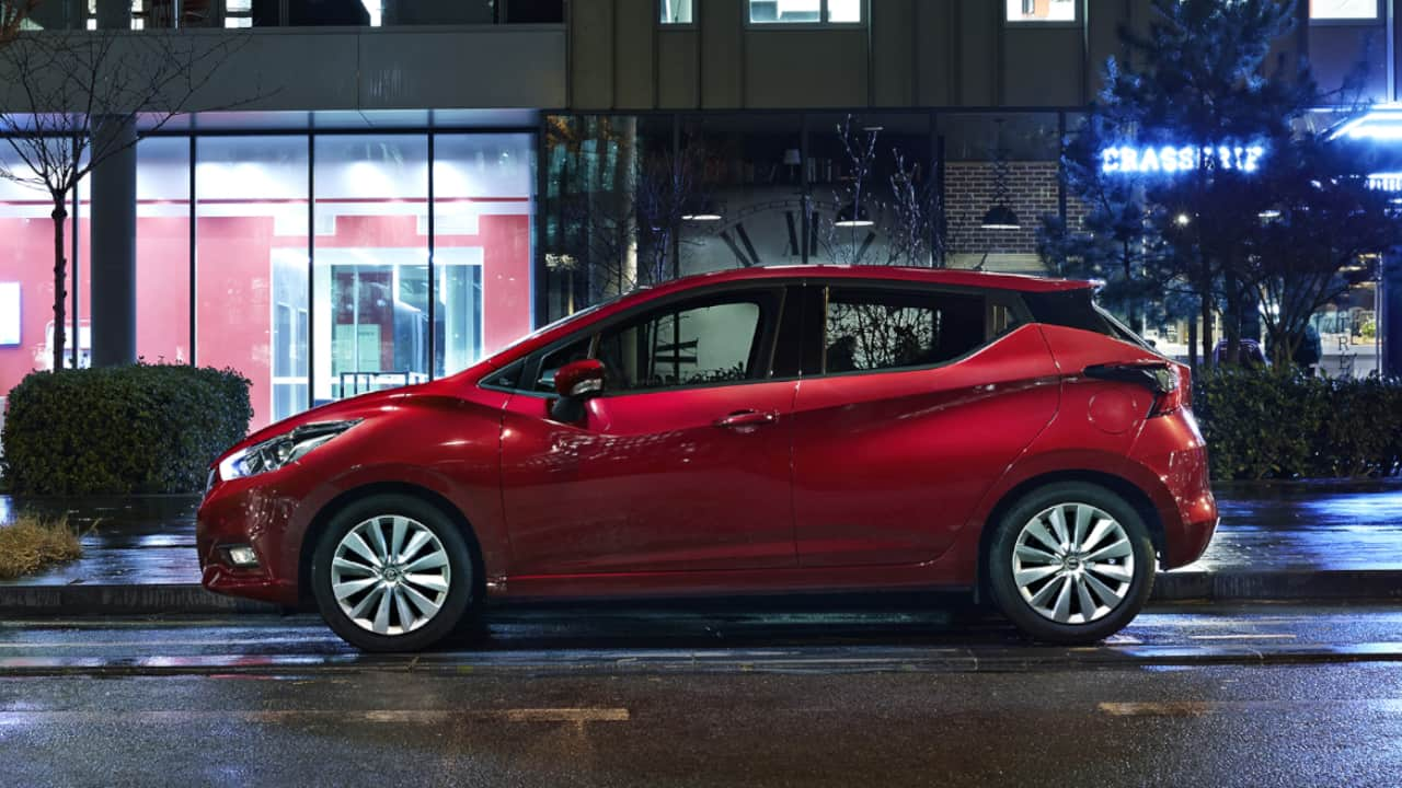 Red Nissan Micra at Night