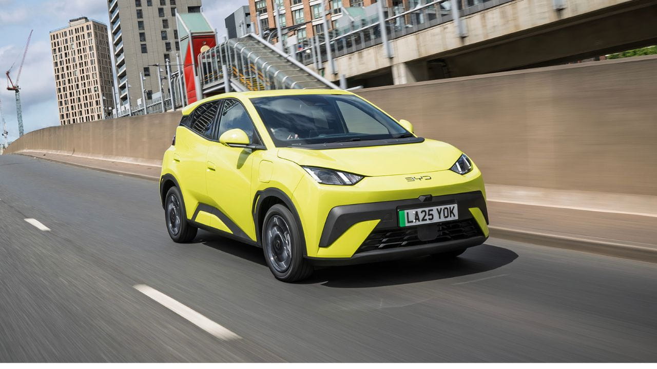 Yellow BYD Surf Dolphin driving down a tunnel