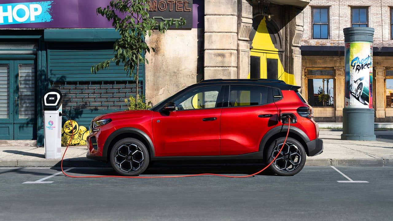 Red Citroen e-C3 being charged in the city