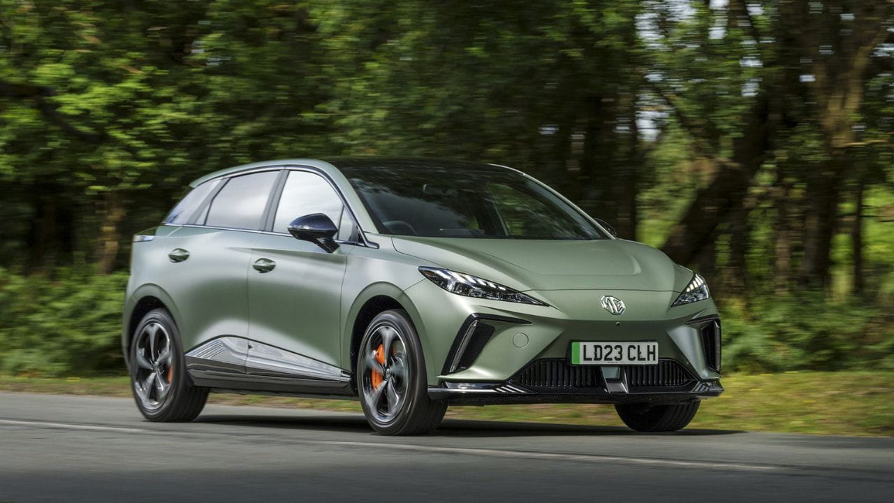 Green MG4 driving in the country side