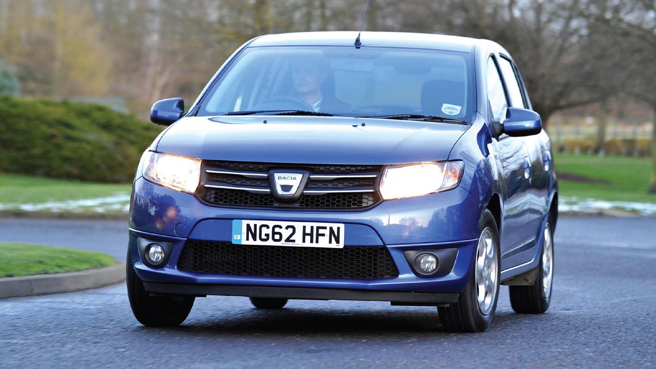 Blue Dacia Sandero, driving