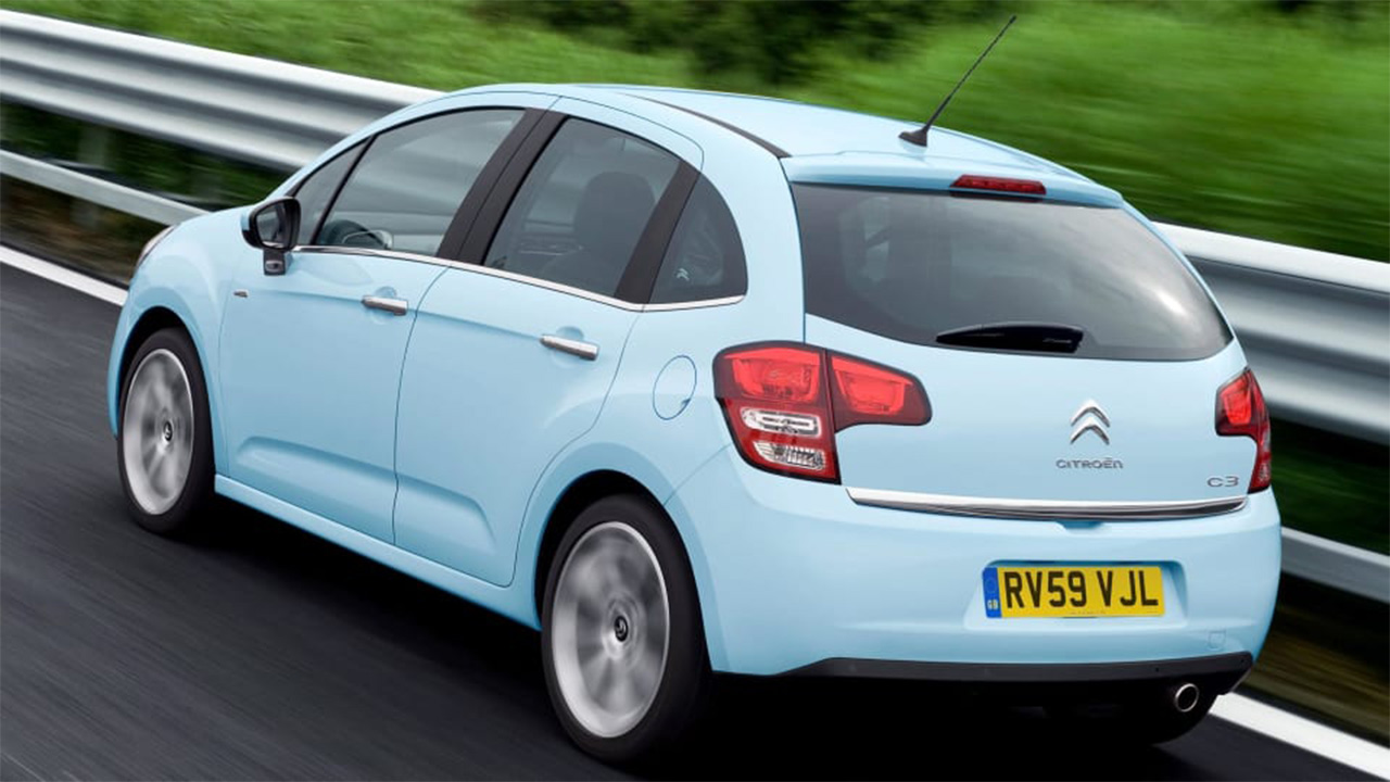 Blue Citroen C3, driving