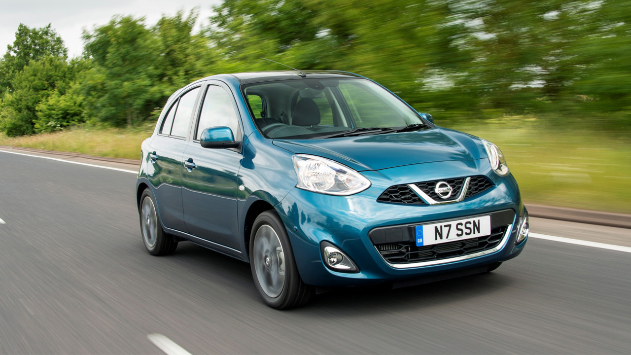 Blue Nissan Micra, driving