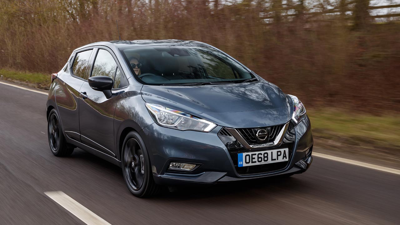 Grey Nissan Micra, driving