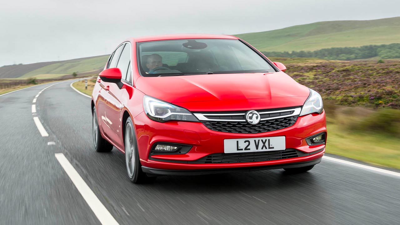 Red Vauxhall Astra, driving