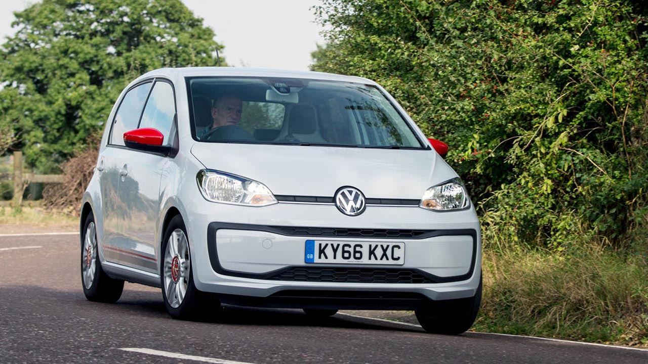 White Volkswagen up!, driving