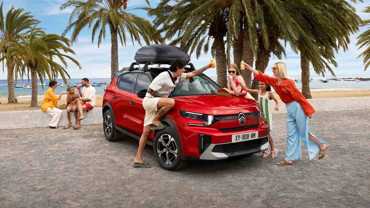 Citroen C3 Aircross with family playing near beach