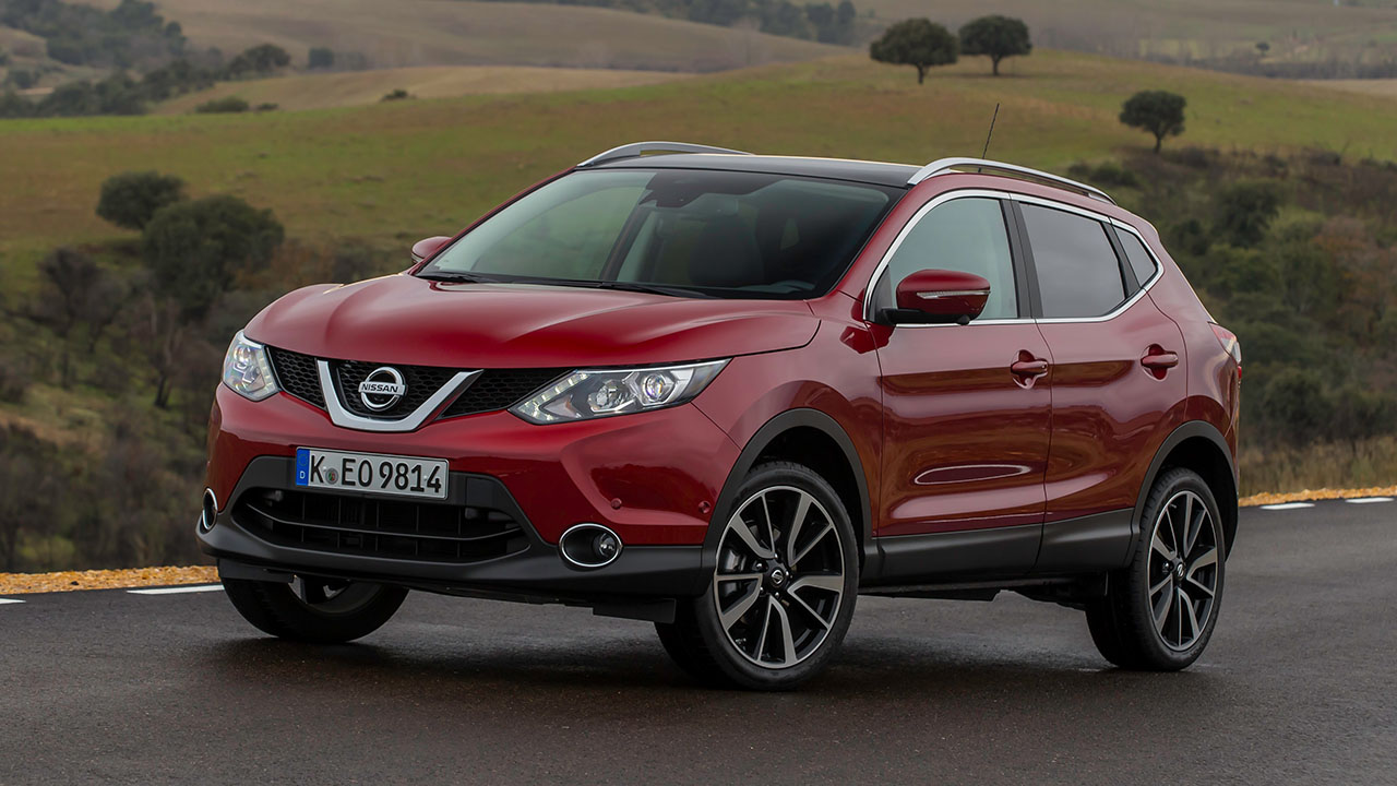 Red Nissan Qashqai, parked in countryside