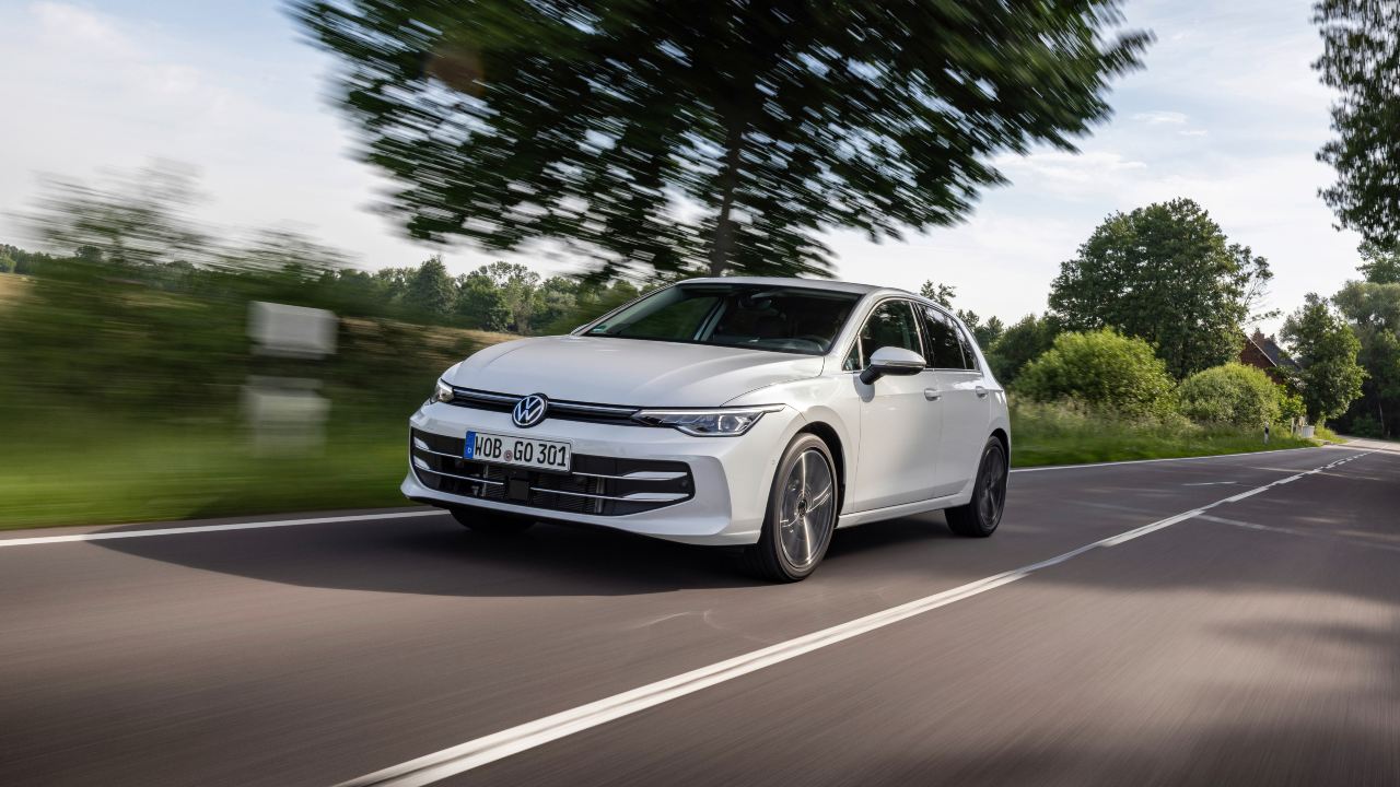 Volkswagen Golf white driving 