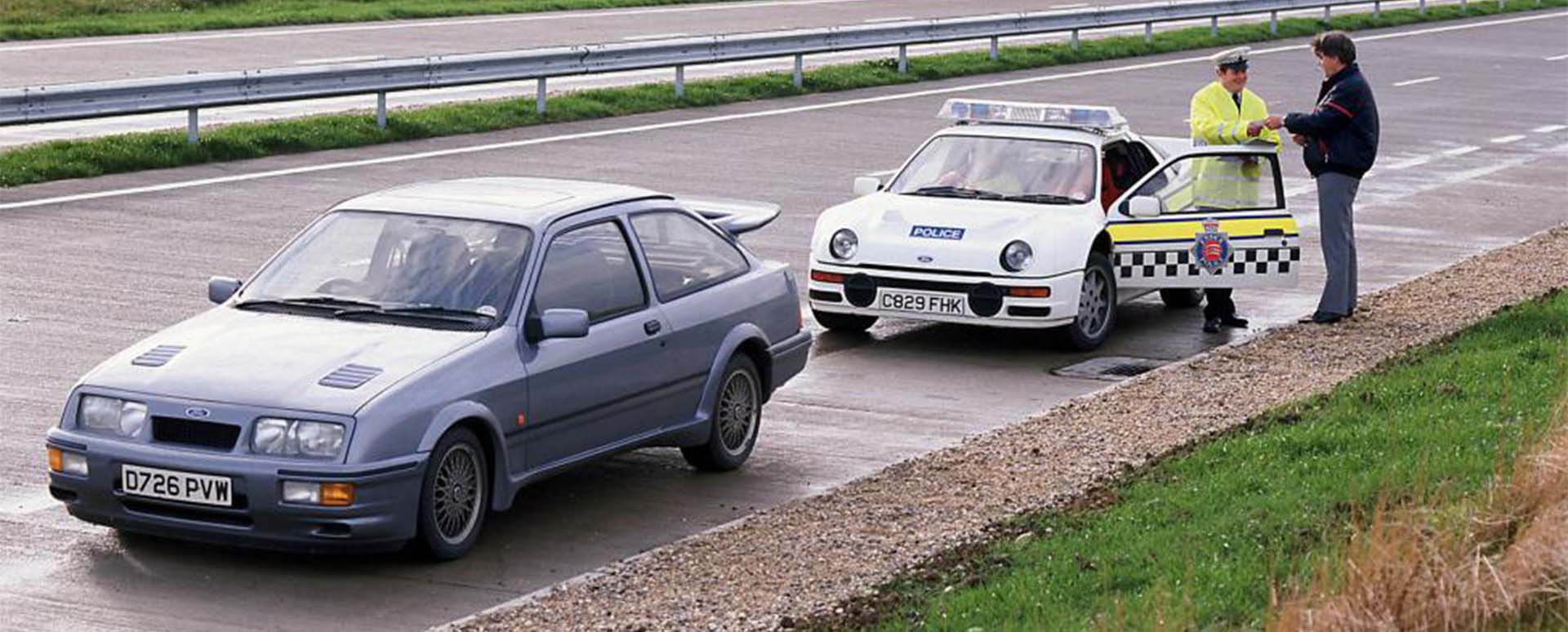 Ford RS200 police car pulling over Ford Sierra Cosworth